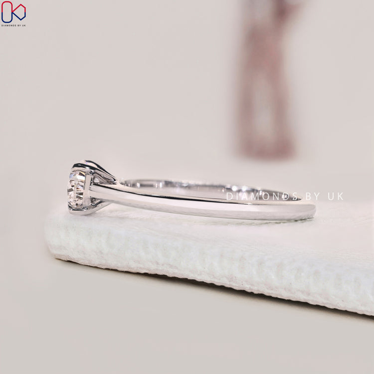 Handmade Ring with IGI Certified Pear Shaped Diamond in white gold.
