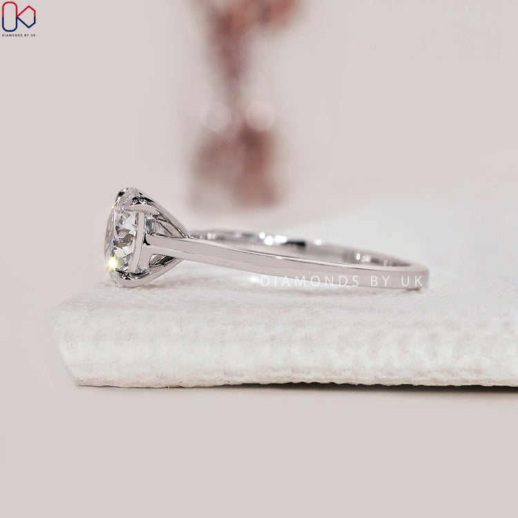 Minimalist solitaire ring with a sleek white gold band.
