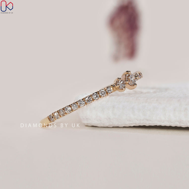 Customize wedding band with prong set diamonds.
