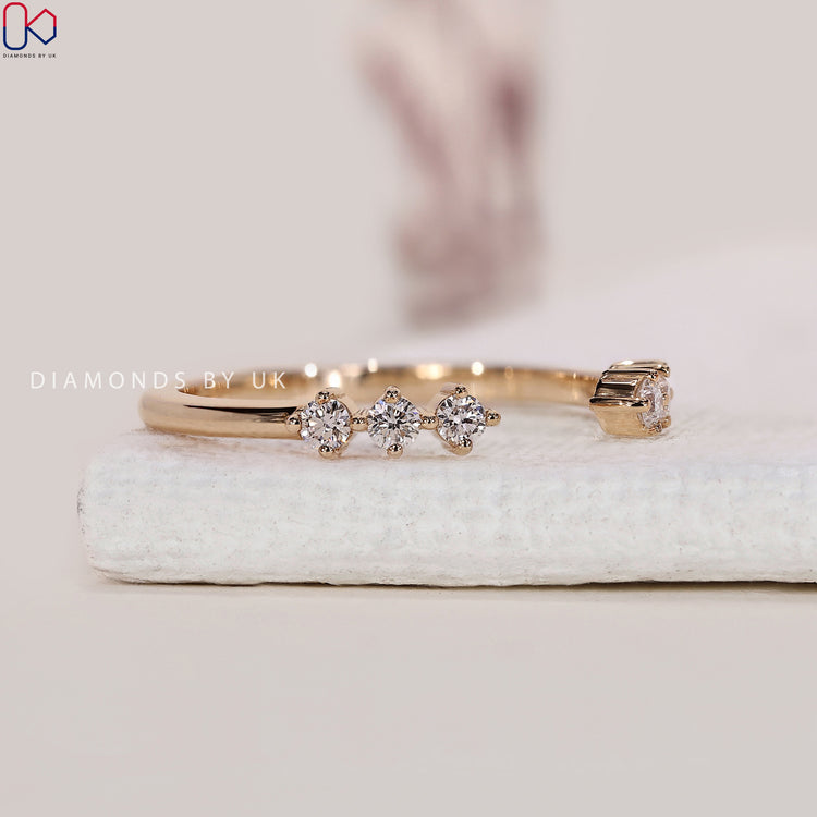 Customise wedding band with a round cut diamond in yellow gold.
