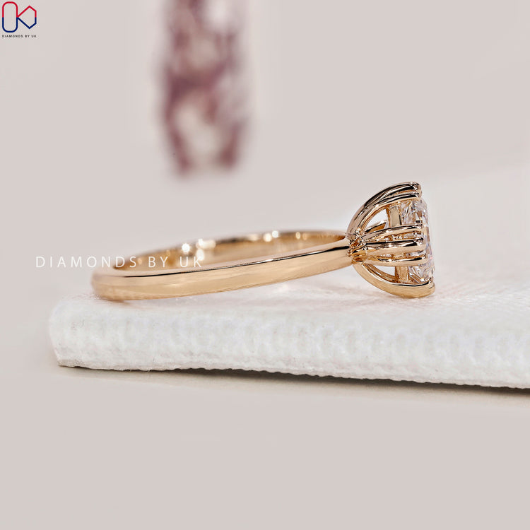 Lab grown diamond asscher cut ring in a solitaire setting.
