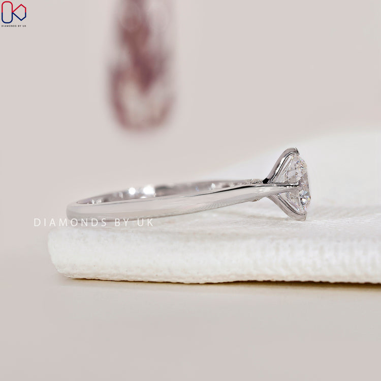 Handmade solitaire ring with bridge accents.
