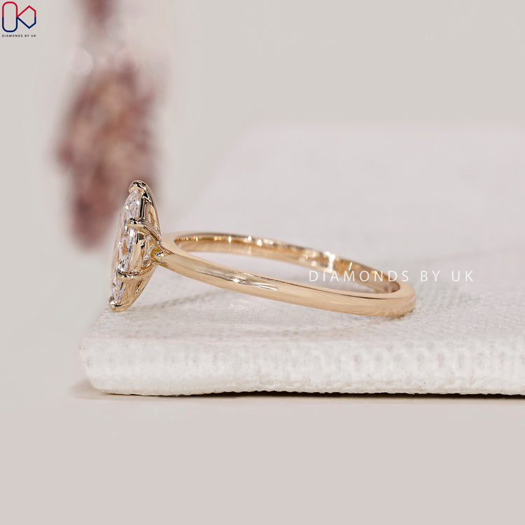 Yellow gold ring featuring a Lab Grown Diamond.
