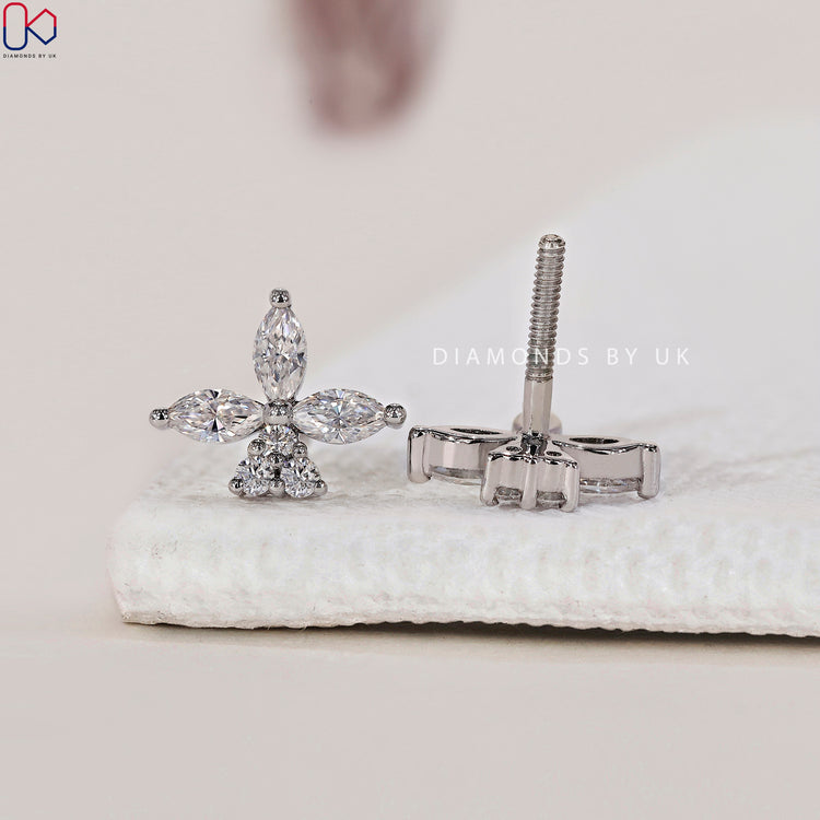 Marquise and round diamond earrings with a unique floral design.
