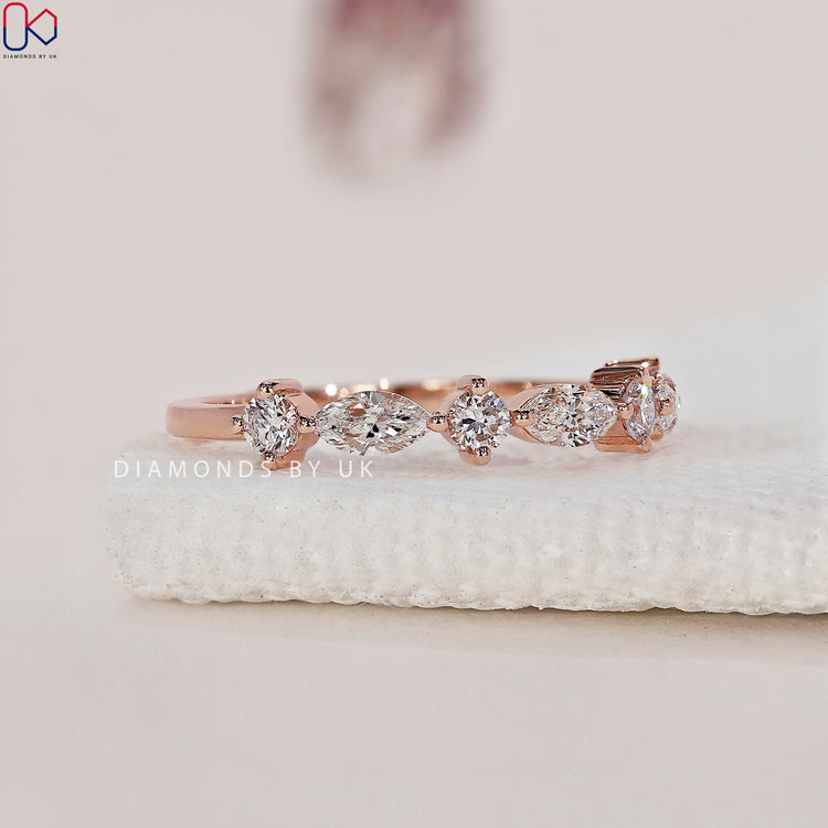 Prong setting wedding band to highlight each diamond.
