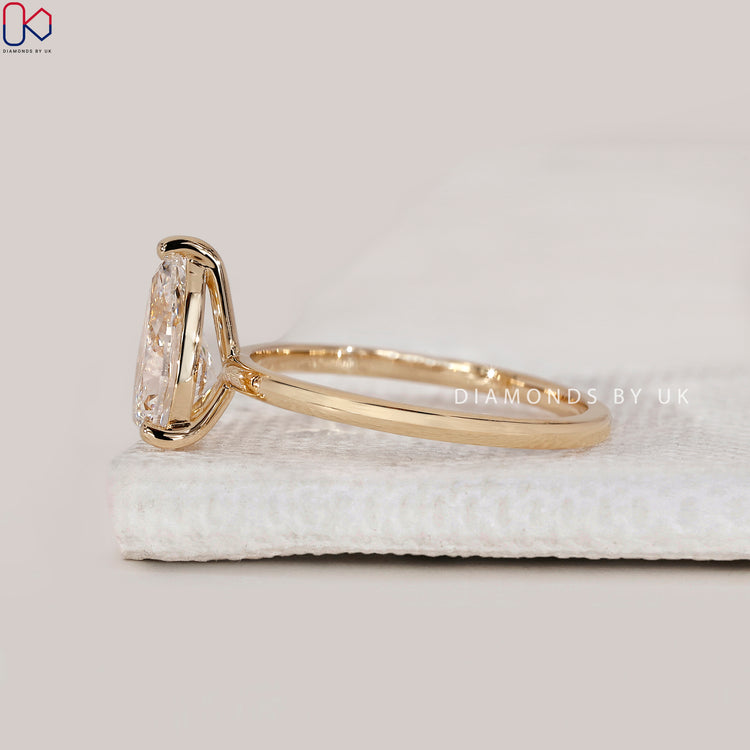 Buy pear solitaire diamond engagement ring online.
