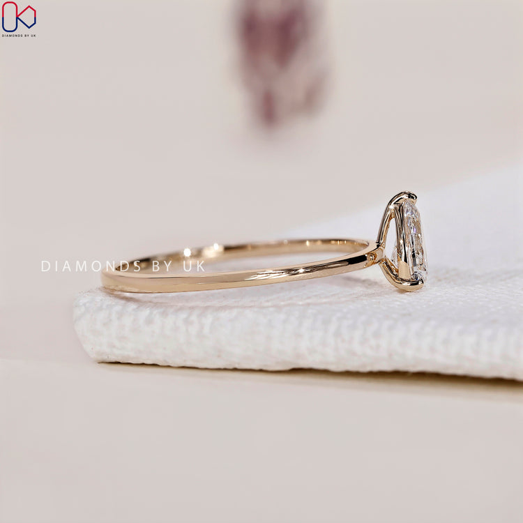 Beautiful handmade jewellery showcasing a pear cut diamond solitaire ring.