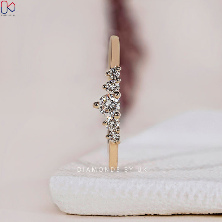 A unique handmade jewelry piece: a round diamond wedding band with timeless appeal.
