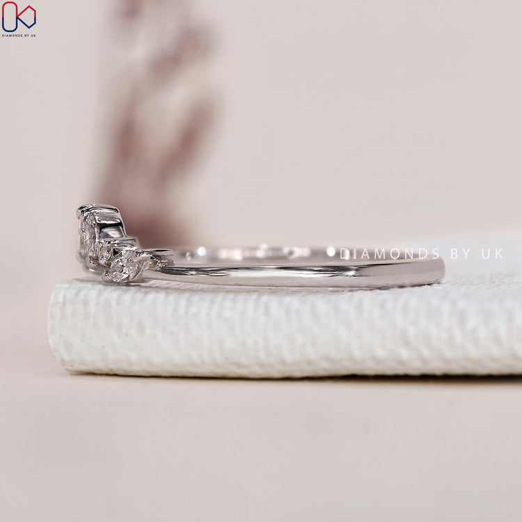 Prong set diamond band ensuring secure and brilliant diamond placement.
