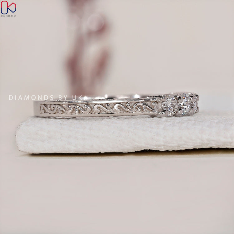 Beautiful 5 stone diamond wedding band offering brilliance and sophistication.