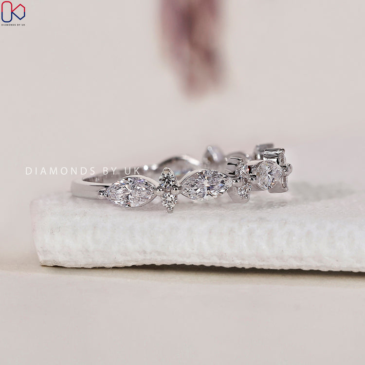 White gold wedding band showcasing lab grown diamonds.
