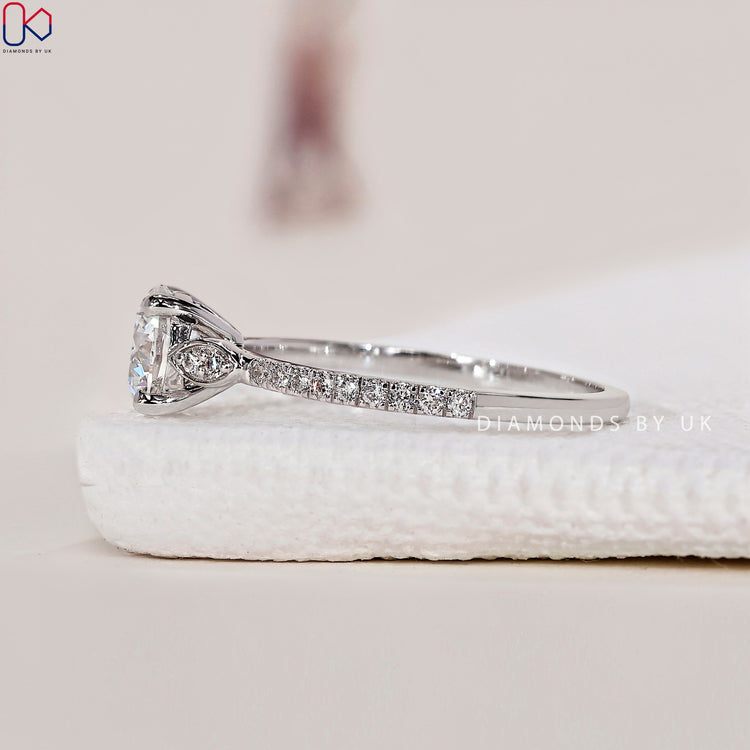 White gold engagement ring with brilliant round diamonds for a timeless look.
