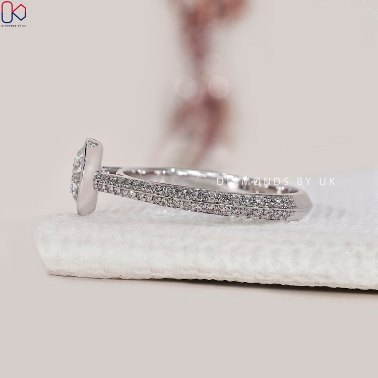 Handmade ring featuring a two sided pave set engagement ring.
