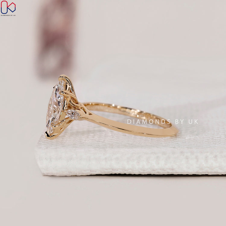 Yellow gold diamond ring with marquise cut stones.
