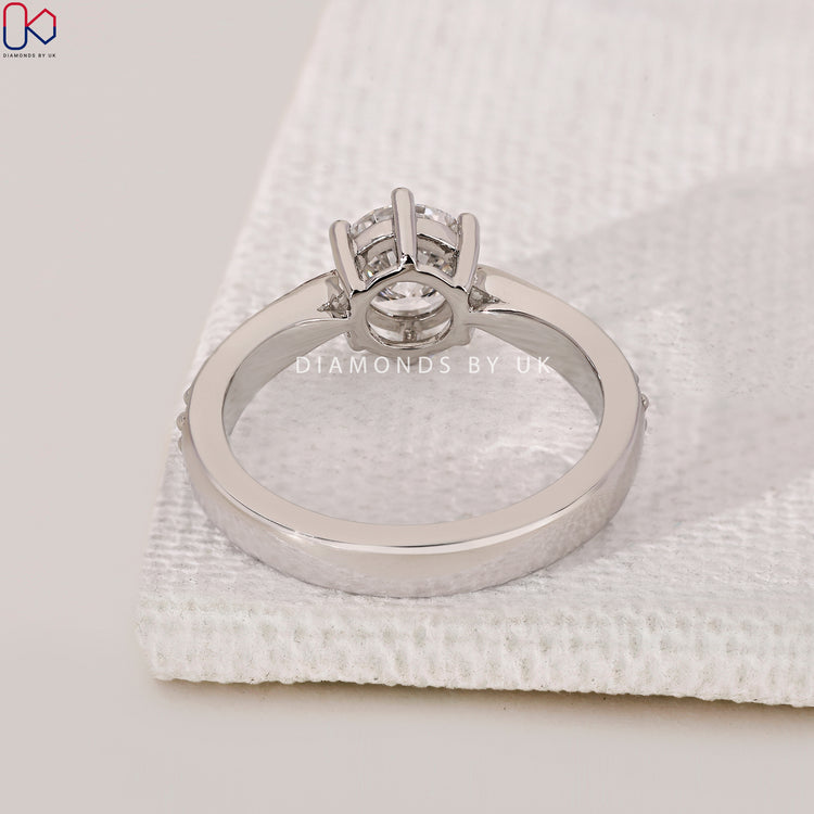 Handmade ring featuring a round cut diamond.
