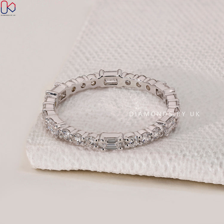 Unique emerald and round cut wedding band showcasing unmatched elegance.