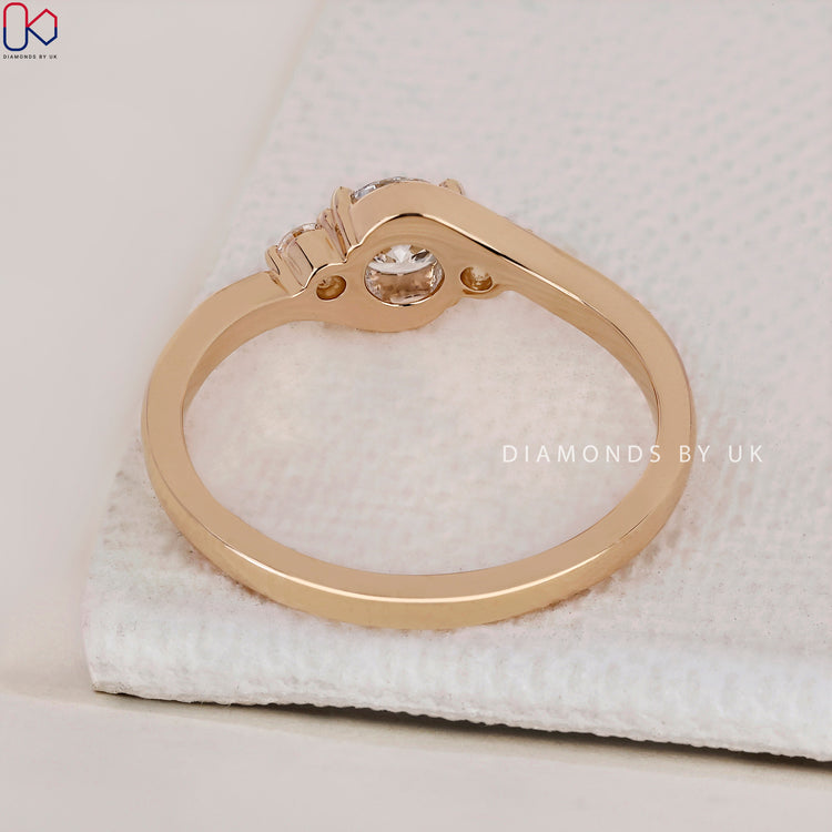 Classic three stone gold ring with a timeless appeal.
