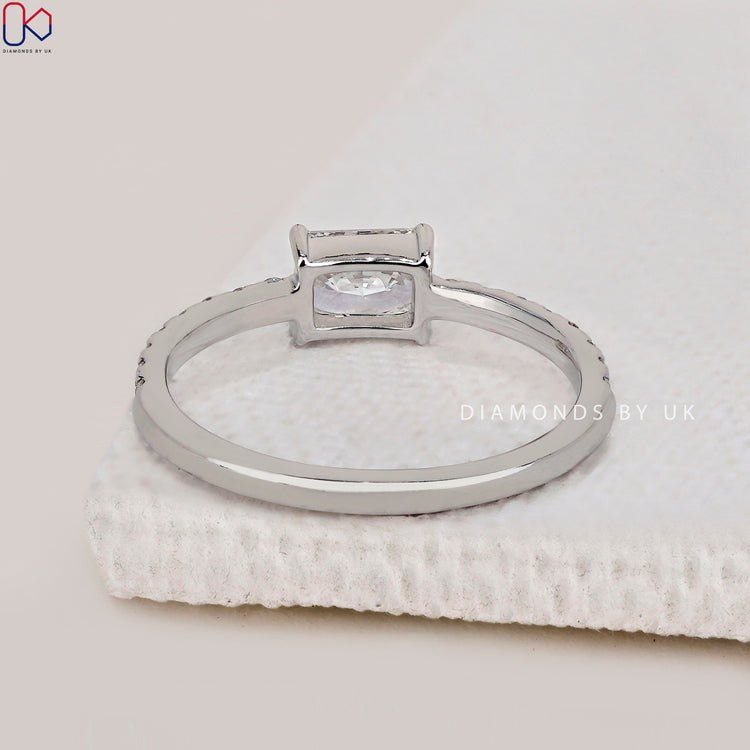 Buy engagement ring with radiant cut diamonds in white gold.
