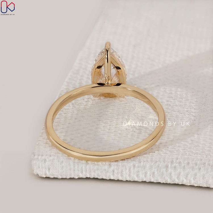 Lab grown pear cut diamond engagement ring.
