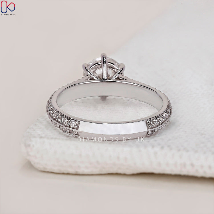 IGI certified round cut diamond ring for guaranteed quality and brilliance.