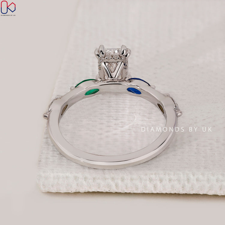 Round side stone ring with white gold band.
