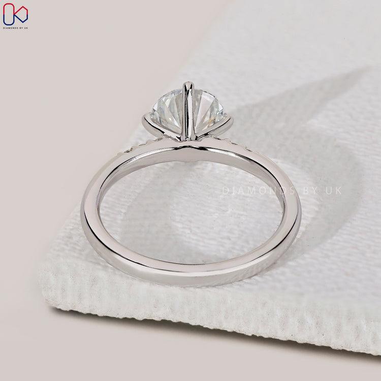 Diamondsbyuk white gold Round cut engagement ring.
