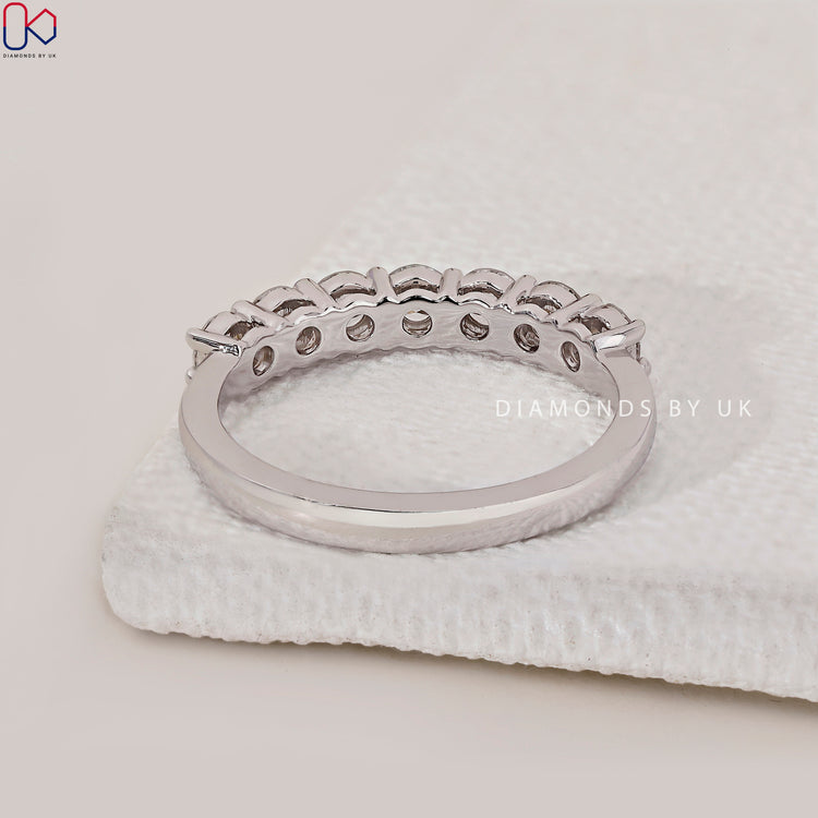 Classic white gold band with prong set round cut diamonds.
