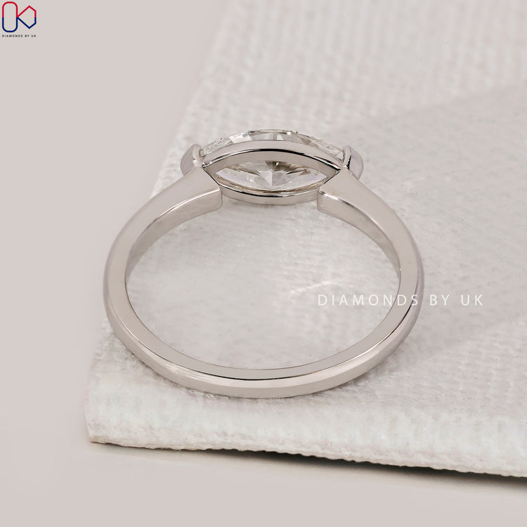 V prong setting ring with marquise cut diamond.
