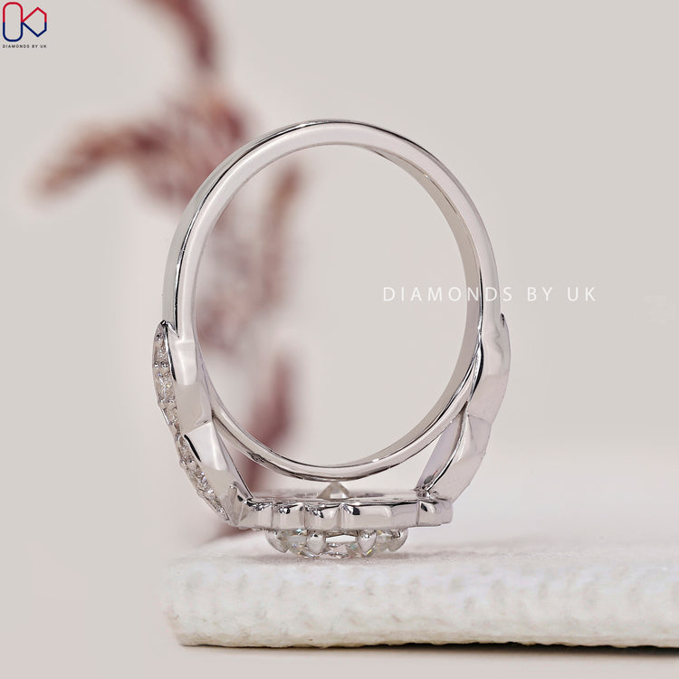 Custom engagement ring with pave band and round diamond.
