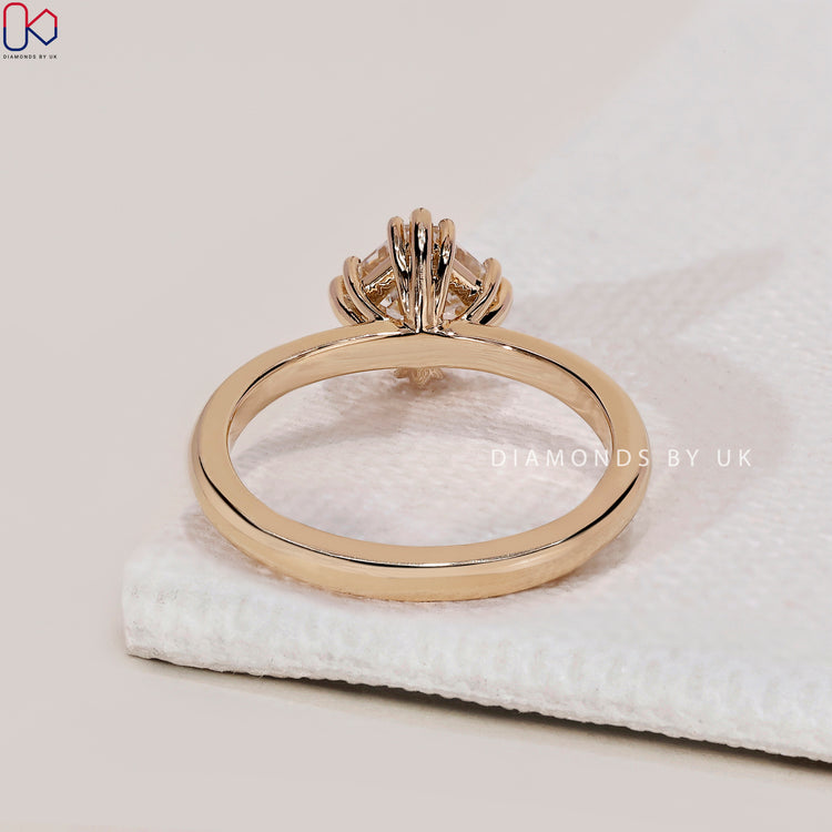 Customise your asscher cut engagement ring with a yellow gold band.
