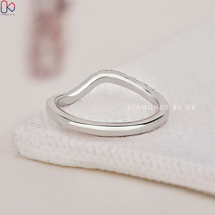 Half eternity wedding band adorned with sparkling diamonds for added charm.
