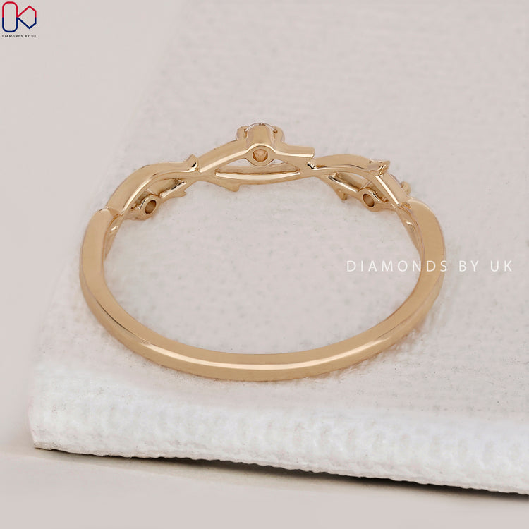 A yellow gold prong set wedding band featuring IGI certified lab grown diamonds.