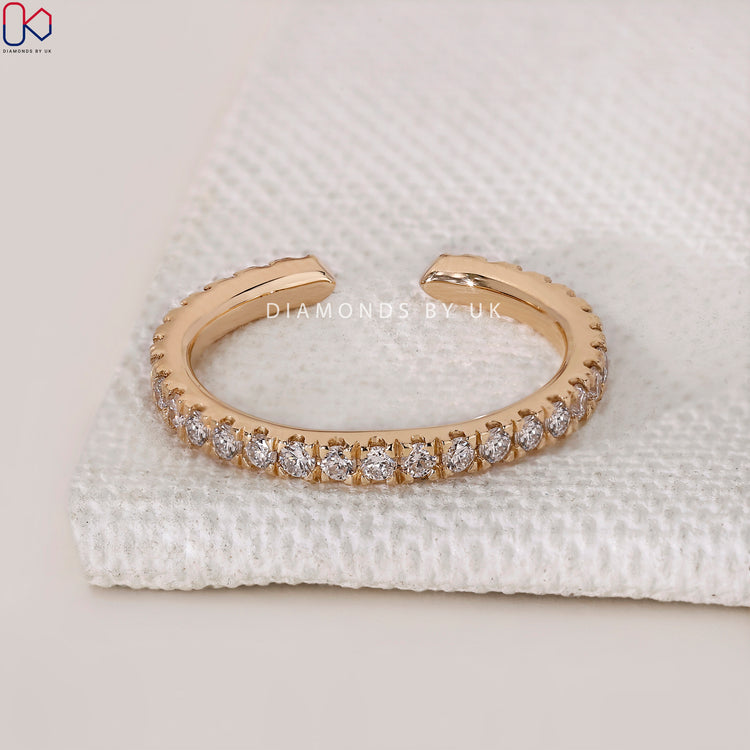 Lab Grown Diamond band in yellow gold open gap design.
