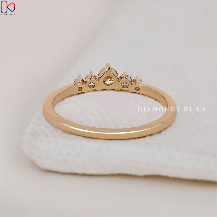 A Diamondsbyuk band featuring a 5 stone diamond design in prong set craftsmanship.