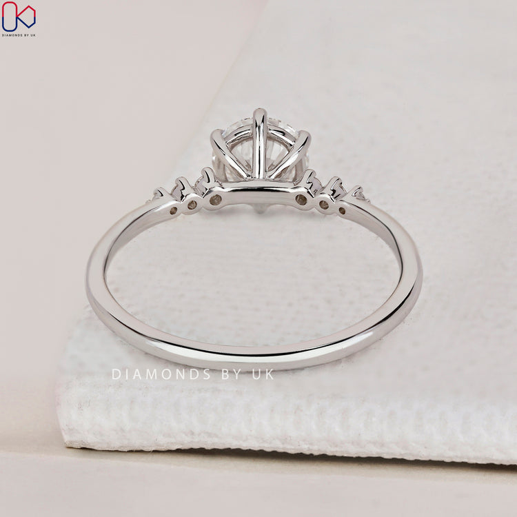 Handmade ring with a stunning round cut diamond ring and 7 stone diamond ring design.

