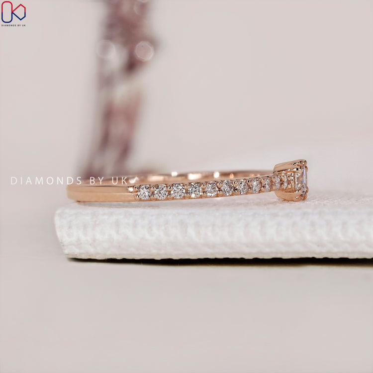 Diamondsbyuk engagement ring featuring a classic pave setting ring and a stunning diamond.
