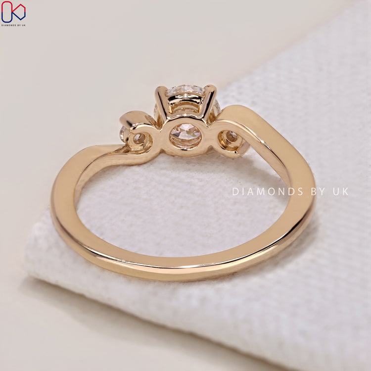 Prong setting engagement ring with diamonds.
