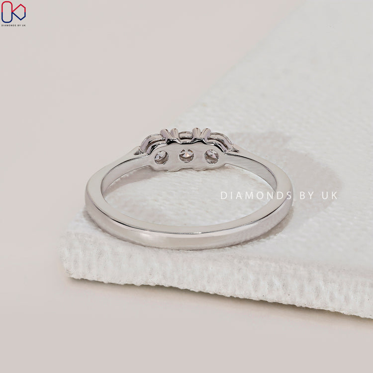 Handmade jewellery band with three brilliant round diamonds.
