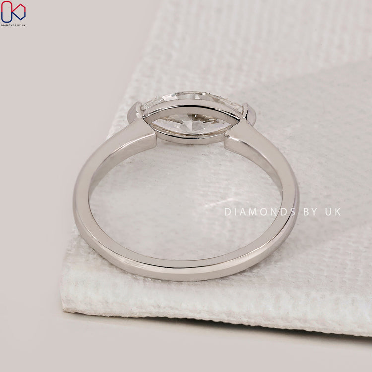 V prong setting ring with marquise cut diamond.
