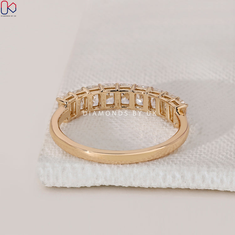 Diamondsbyuk wedding band in yellow gold with handmade detailing.
