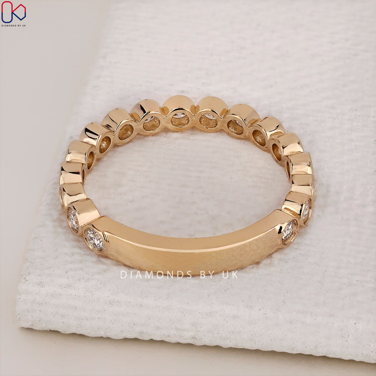 IGI certified yellow gold wedding band with sparkling diamonds for quality assurance.
