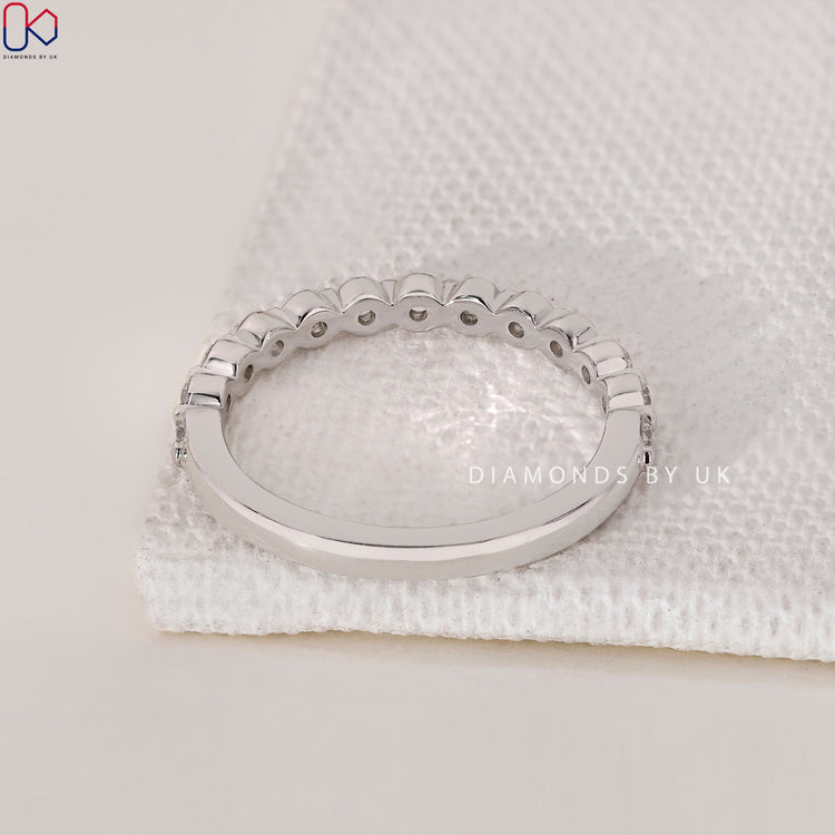 A delicate handmade ring featuring an igi certified Lab Grown Diamond for lasting brilliance.
