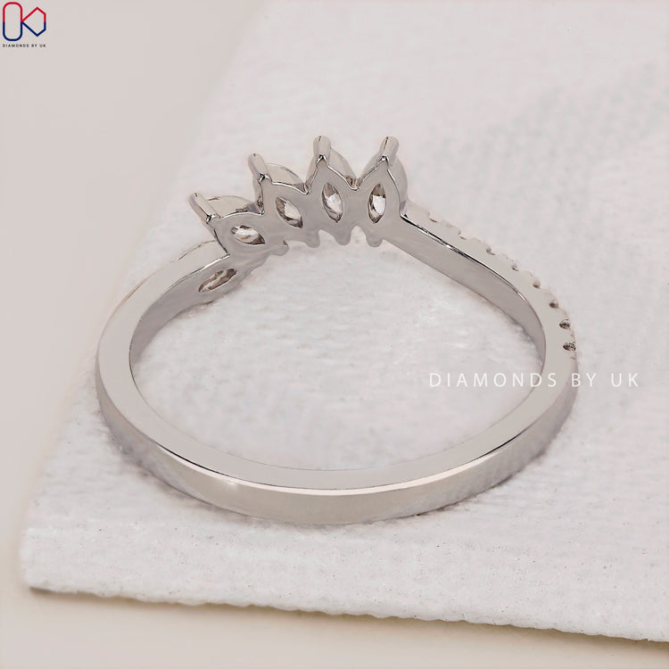 Handmade jewelry Tiara wedding band with radiant diamonds set in white gold.
