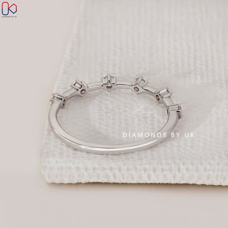 Custom handmade round diamond wedding band in white gold.
