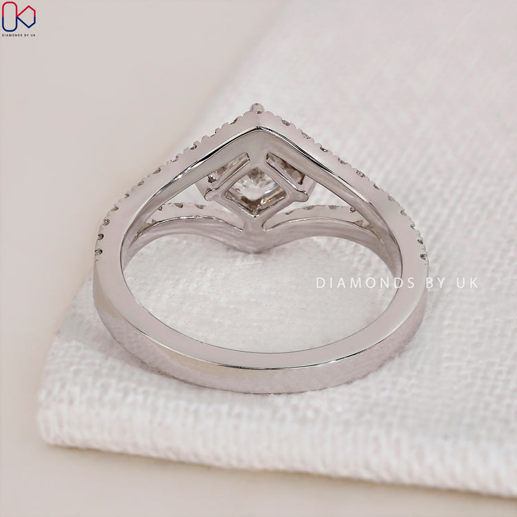 Handmade engagement ring with intricate details.
