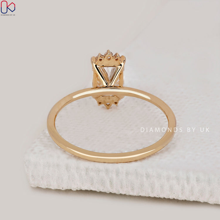 Diamondsbyuk engagement ring featuring a radiant cut diamond.
