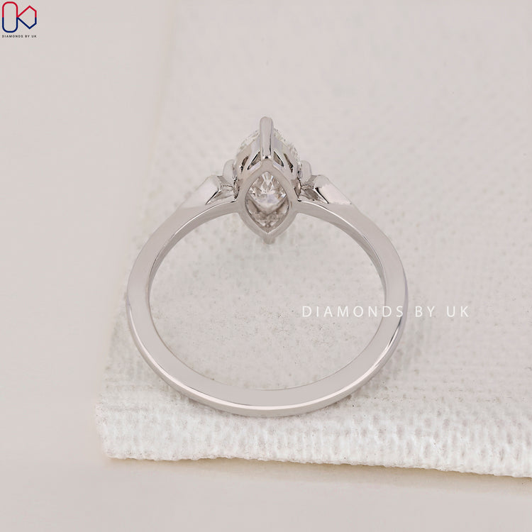 Lab Grown Diamond Marquise and Round Engagement Ring with side diamonds.
