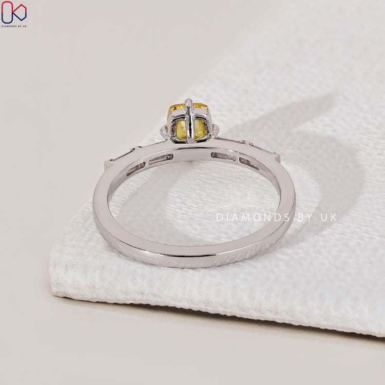 Handmade jewellery featuring a yellow diamond ring.
