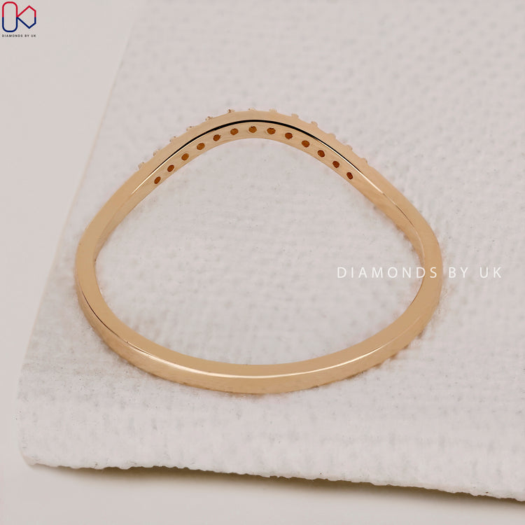 Micro pave wedding band with diamonds set in a sleek design.
