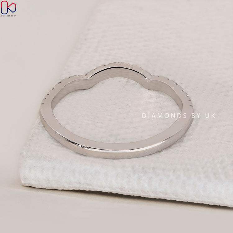 Half eternity wedding band offering timeless elegance and comfort.
